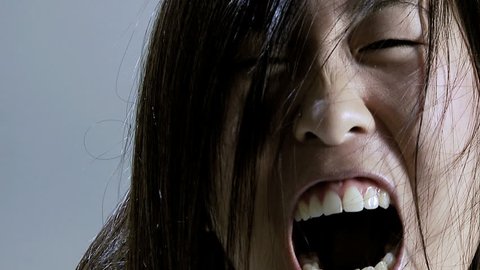 Zombie vampire asian girl screaming desperate