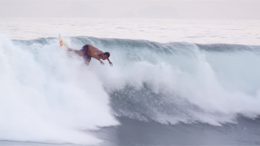 RIO DE JANEIRO, BRAZIL - JUNE: A surfer catches a wave on a short board off the