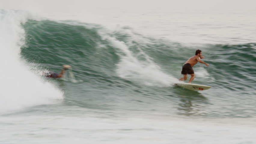 RIO DE JANEIRO, BRAZIL - JUNE 23: Close daylight shot of surfer riding a wave