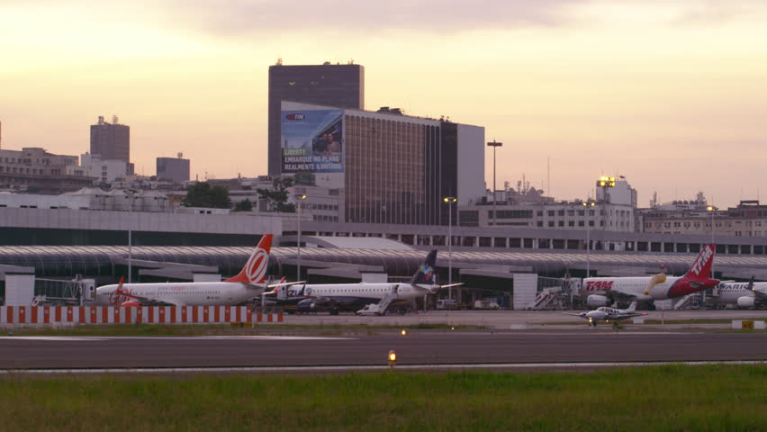 RIO DE JANEIRO, BRAZIL - JUNE 21: Small plane, taxis down runway in front of Rio