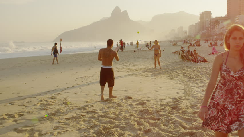 RIO DE JANEIRO, BRAZIL - JUNE: A couple playing tennis on Ipanema beach together