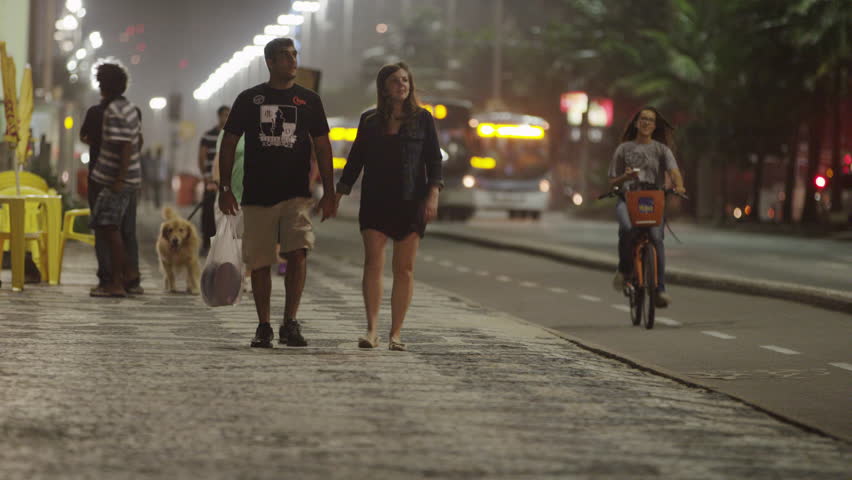 RIO DE JANEIRO, BRAZIL - JUNE: Couple walking and holding hands in Rio.
