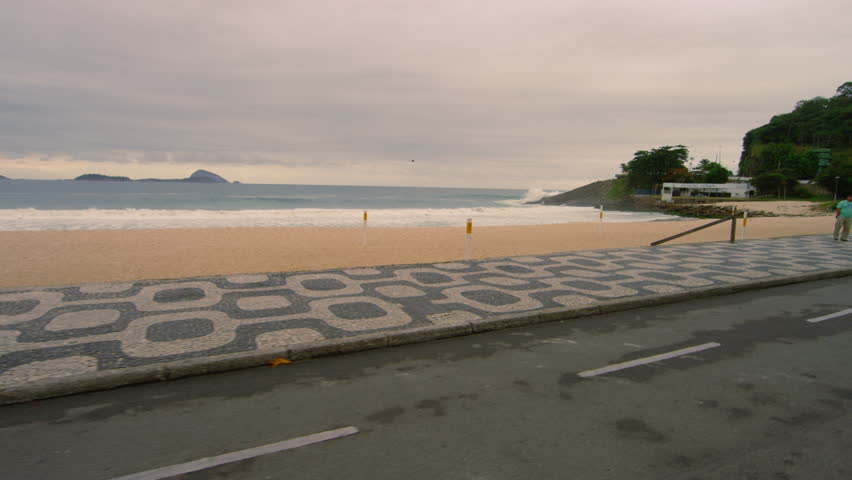 RIO DE JANEIRO, BRAZIL - JUNE 23: Slow dolly shot of skateboarders at Ipanema
