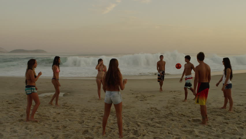 RIO DE JANEIRO, BRAZIL - JUNE: A group of teens playing soccer (football) on