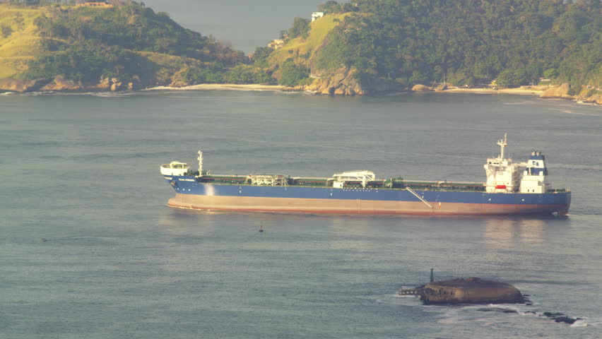 RIO DE JANEIRO, BRAZIL - JUNE: Barge slowly moving across Guanabara Bay