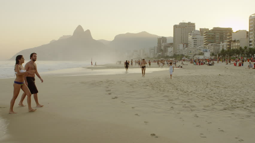 RIO DE JANEIRO, BRAZIL - JUNE 16: People walking on Ipanema beach on June 16,