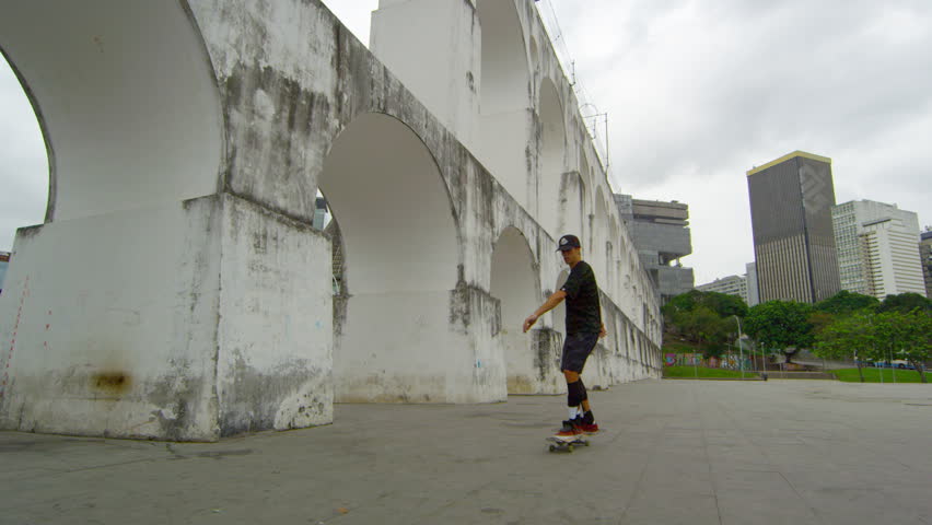 RIO DE JANEIRO, BRAZIL - JUNE 23: Slow dolly shot of spinning skateboarder on