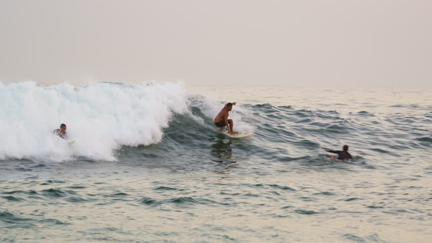 RIO DE JANEIRO, BRAZIL - JUNE: Close shot of bodyboarders and surfers offshore