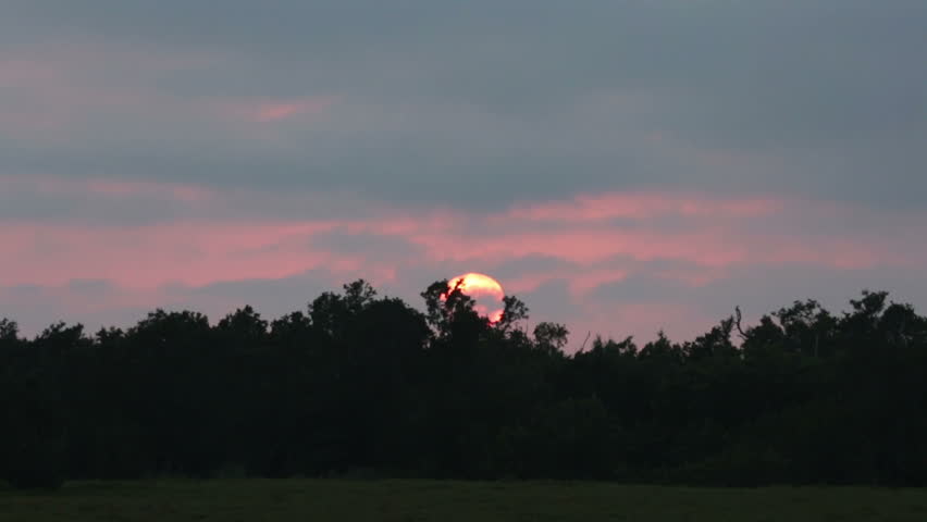 Sunset over Everglade National Park. Sunset over Everglades National Park, Florida.  Travel for enjoyment to view and discovery new locations and nature. Fast motion, time lapsed.