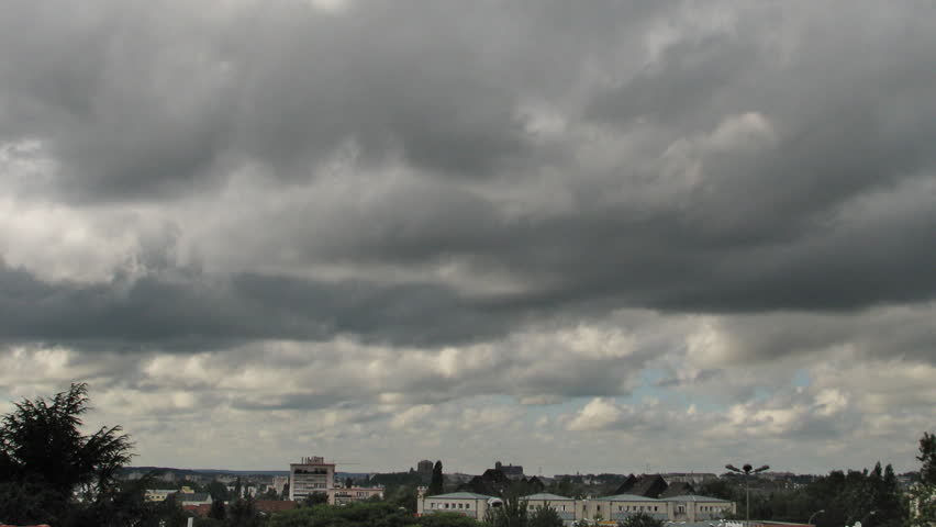 Clouds running over city, HD time lapse clip