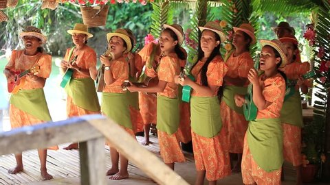 BOHOL, PHILIPPINES - FEBRUARY 21, 2014 : Unidentified folk music band performs in traditional Philippine background for tourists