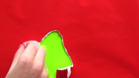 Hands unwrap box to reveal green screen background