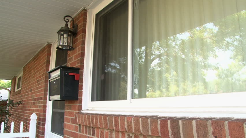 Dolly Shot of Girl Getting Mail