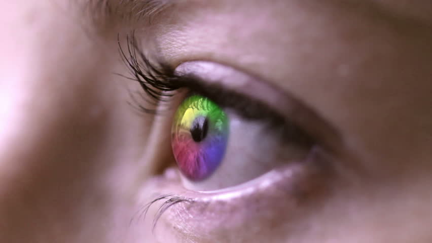 A young woman's eye is coloured with the four main colours and blended on top of the original for effect. | Shutterstock HD Video #6146285