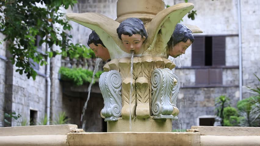 Fountain in the courtyard of the old catholic church of the Basilica del Santo Niño. Cebu, Philippines.