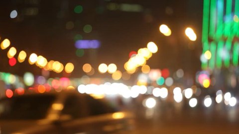 Night city lights and traffic background. Out of focus background with blurry unfocused city lights and driving cars and car light. Moscow, Russia