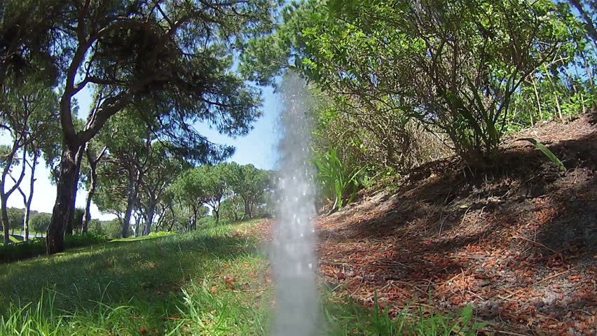 Garden Irrigation Sprinkler watering lawn (Point of View footage)
