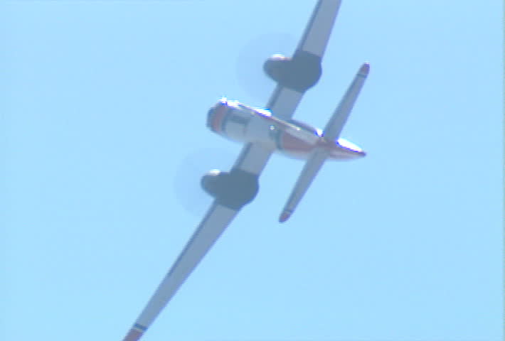 A fixed-wing patrol aircraft banks left.