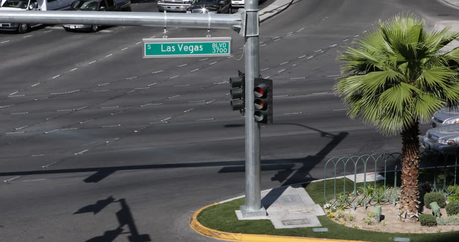 Aerial Las Vegas Strip Boulevard Street Sign Red Green Traffic Light Palm Trees ( Ultra High Definition, Ultra HD, UHD, 4K, 2160P, 4096x2160 )