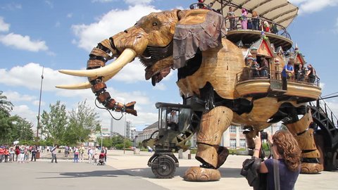NANTES, FRANCE - JUNE 25. Elephant machine roaring. This is a tourist attraction in Nantes. Giant creation has become something of an unofficial icon - Nantes in France 25. june 2013.