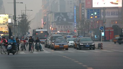 China - October 2013: Smog at dusk commuters going home Wangfujing shopping street central Beijing