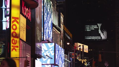 New York, USA - October 25, 2009 - Medium Shot Illuminated advertisements at Times Square at night