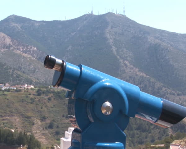 PAL: Man looking through telescope