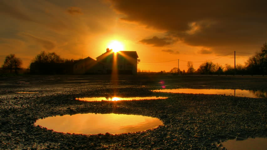 Sunset over house and water ponds, HD time lapse clip, high dynamic range