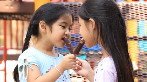 Asian kids enjoy eating with icecream together