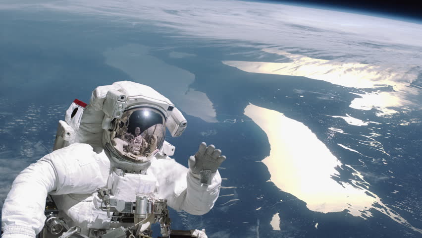 Astronaut Waves While On a Stock Footage Video (100% Royalty-free ...