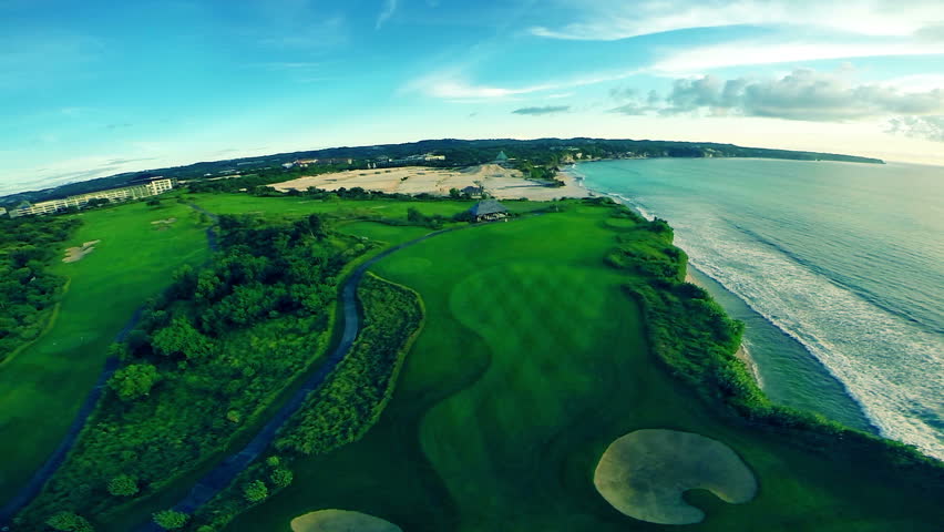 Flight over beautiful golf course with views of the indian ocean in the