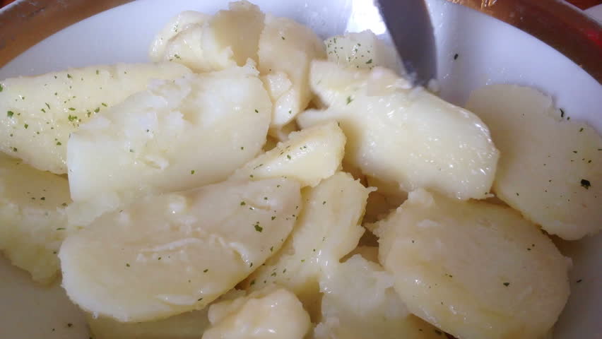 Boiled potato decorated with parsley