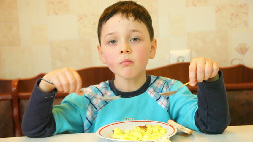 little boy having lunch at home