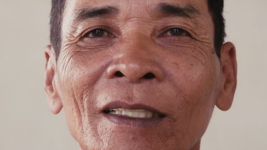 Portrait of real Asian people, with emotions and feelings, looking at camera, seniors. Serious old man from Cambodia, Asia. Closeup of face, 54of56