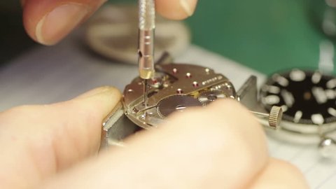 watchmaker assembles a watch