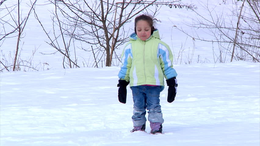 A cold little girl in the snow is done playing and wants her mother.
