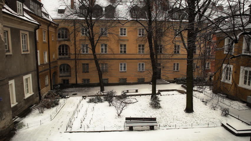 snowing in the courtyard of old town in Warsaw