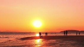 People on holiday look golden sunset sundown at ocean beach. Calm nature HD video