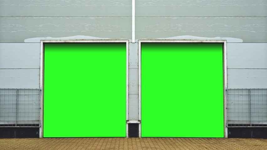 Industrial Unit with roller shutter doors. Warehouse storage doors with green screen mate background are closing. 1920x1080, 1080p, hd, high definition footage. Royalty-Free Stock Footage #6204209