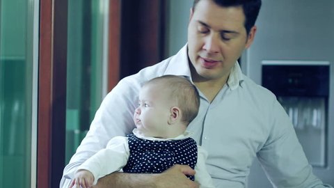 Portrait Of Father With Newborn Baby At Home: stockvideo