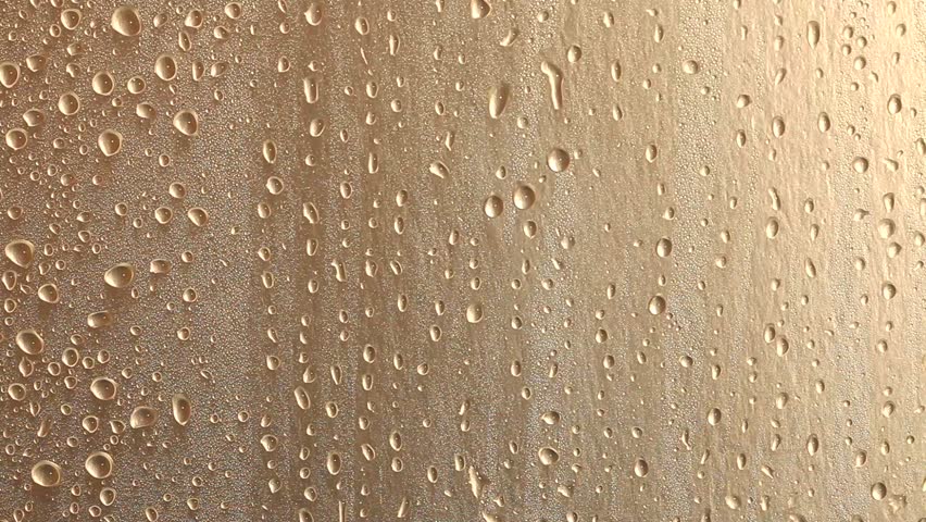 closeup of raindrops on metal surface