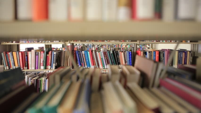 Library books and newspaper stacks - 3 clips