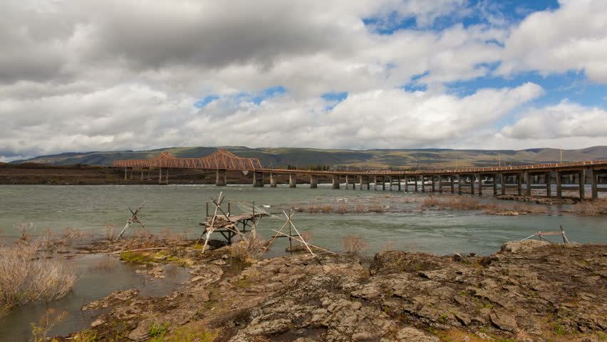 The Dalles Dam and Dalles Bridge Across Columbia River Gorge Between Washington and Oregon State Moving White Clouds and Blue Sky Time Lapse 1920x1080