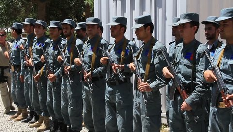 Kabul, Afghanistan, Circa 2011:  Pan shot of young Afghan Police Trainees standing in review in Kabul, Afghanistan, Circa 2011