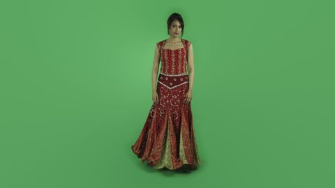 woman in traditiona indian outfit isolated on green upset anger