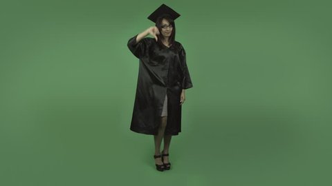 adult student graduate isolated on green upset worried