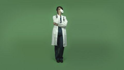 indian female doctor relaxing during coffee break isolated on greenscreen