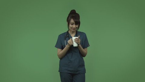 indian female doctor relaxing isolated on greenscreen