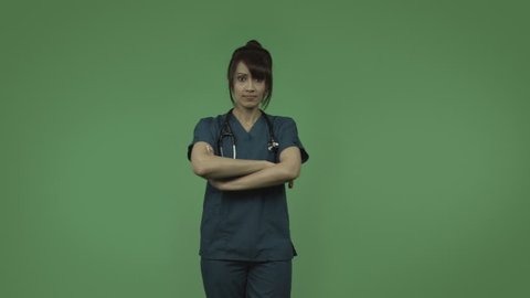 indian female doctor isolated on greenscreen with fingers on lips