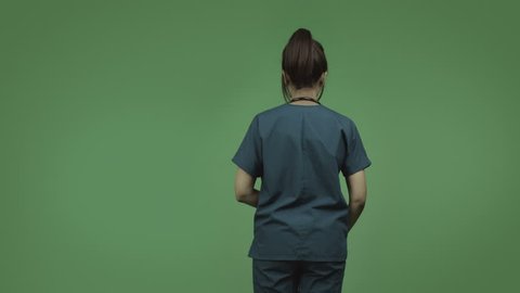indian female doctor isolated on greenscreen with help sign